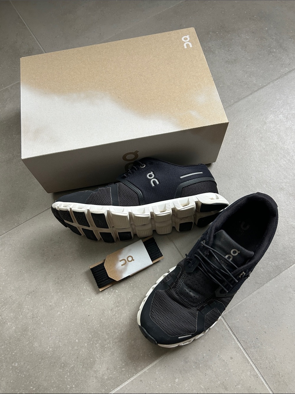 On Running Black and White Cloud Athletic Shoes